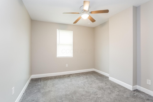 unfurnished room featuring ceiling fan and light carpet