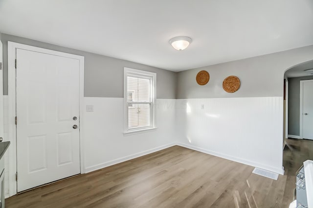 unfurnished room with light hardwood / wood-style flooring