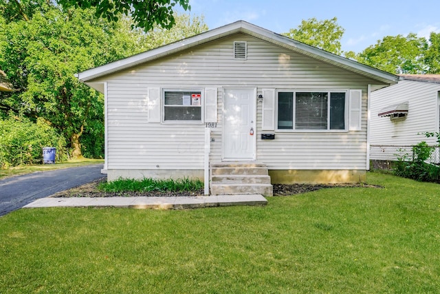 bungalow with a front lawn