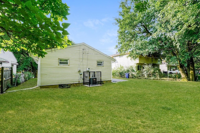 rear view of property featuring a yard