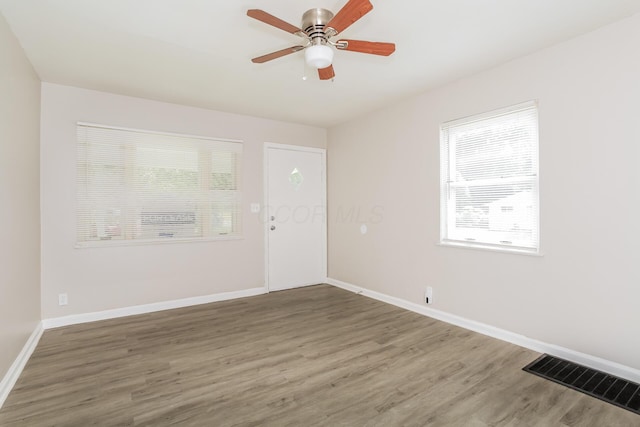 unfurnished room featuring ceiling fan and wood-type flooring