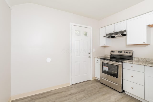 kitchen with white cabinets, light wood-type flooring, light stone countertops, and stainless steel range with electric cooktop