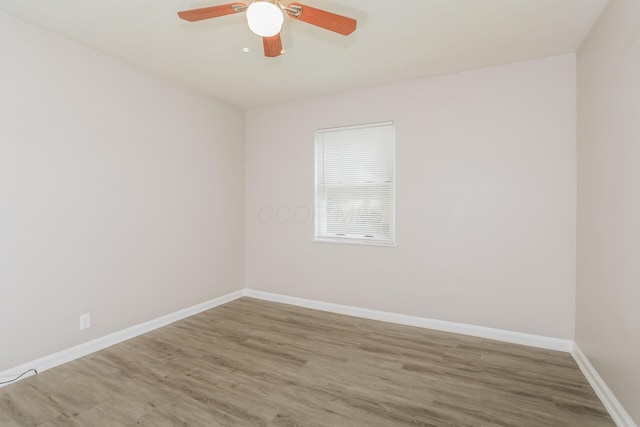 unfurnished room featuring ceiling fan and wood-type flooring