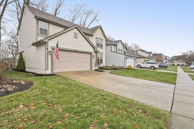 view of property with a garage and a front lawn