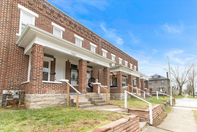 view of property featuring a porch