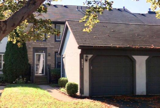 view of front of property featuring a garage and stucco siding