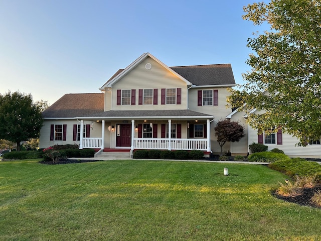 view of front of home featuring a porch and a front lawn