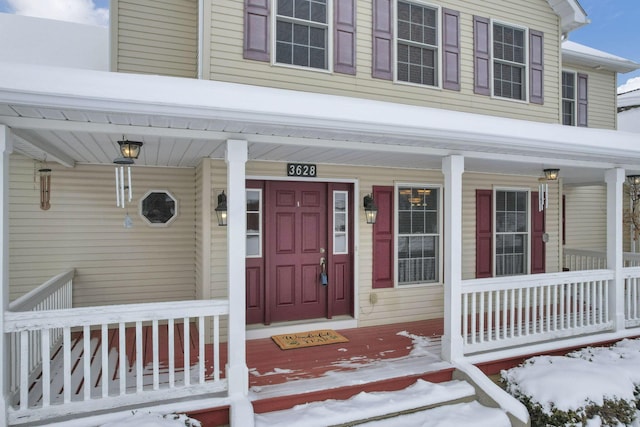 view of snow covered property entrance