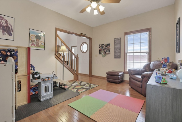 exercise room featuring hardwood / wood-style flooring and ceiling fan