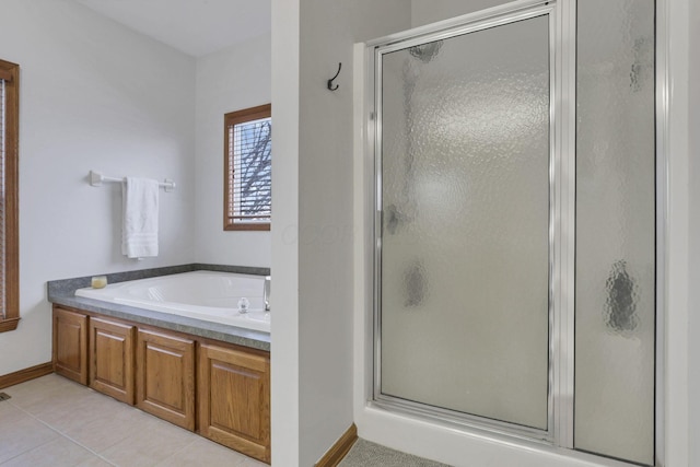 bathroom featuring tile patterned flooring and plus walk in shower