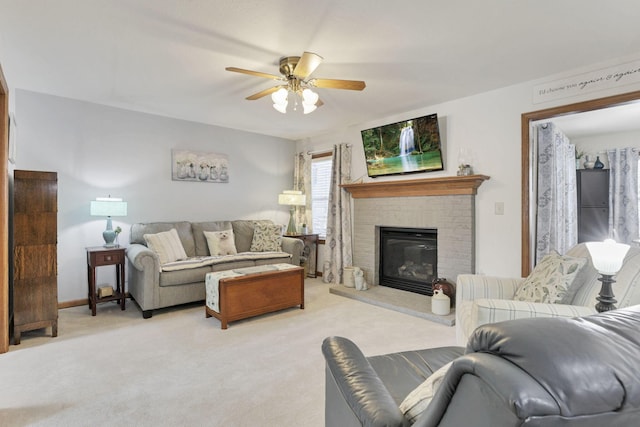 living room featuring ceiling fan, light carpet, and a brick fireplace