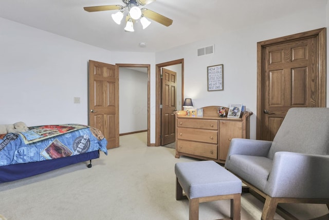 bedroom featuring light colored carpet and ceiling fan