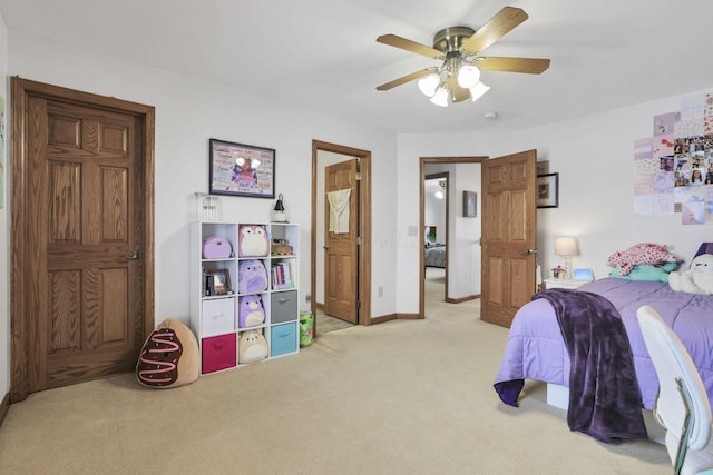 bedroom featuring ceiling fan and light colored carpet