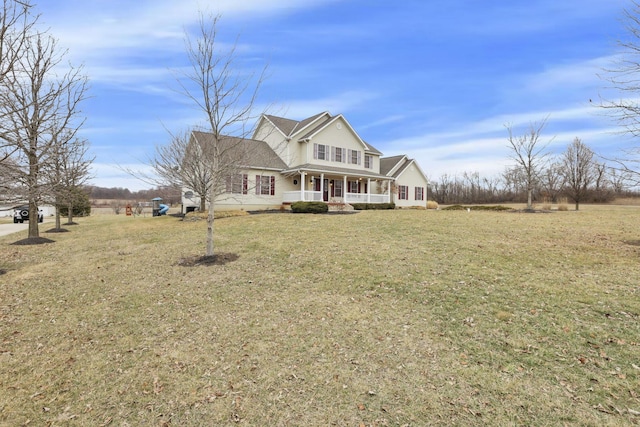 view of front of house with a front yard and covered porch