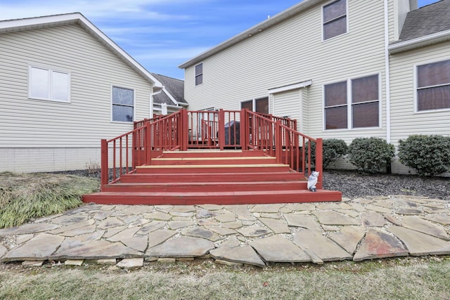 back of house with a wooden deck