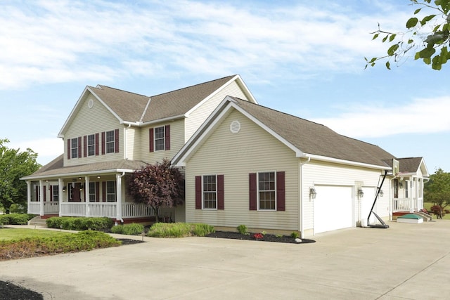 3628 State Route 361, Circleville, OH 43113 - view of front facade featuring driveway, a porch, and an attached garage