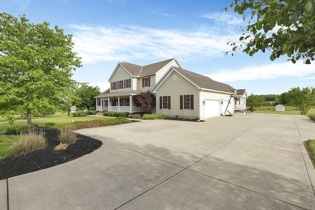 3628 State Route 361, Circleville, OH 43113 - traditional home with driveway, an attached garage, and a porch