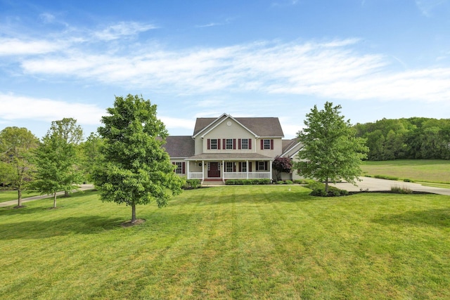 3628 State Route 361, Circleville, OH 43113 - traditional-style home with a porch, a front yard, and a shingled roof