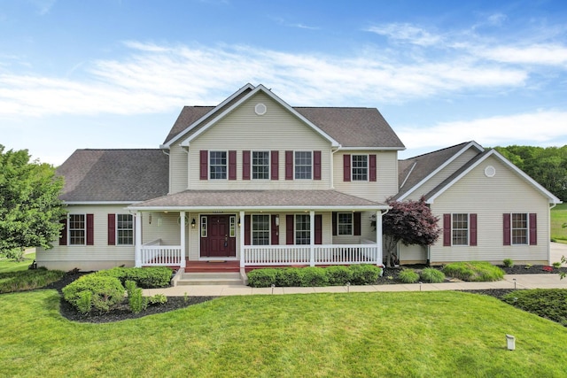 3628 State Route 361, Circleville, OH 43113 - view of front facade with covered porch, a front lawn, and roof with shingles