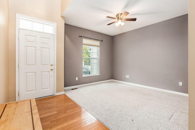 foyer featuring ceiling fan and hardwood / wood-style flooring