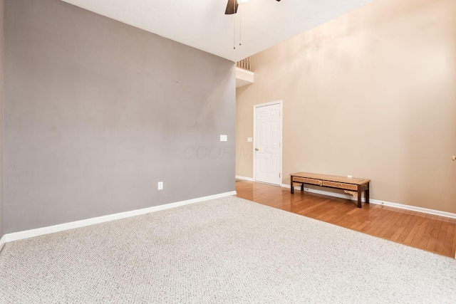 unfurnished room featuring ceiling fan and wood-type flooring