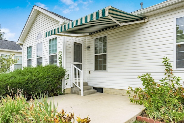 property entrance with a patio