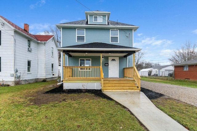 view of front of house featuring a front lawn and covered porch