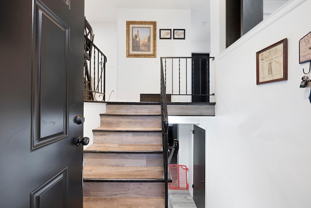 staircase featuring hardwood / wood-style flooring