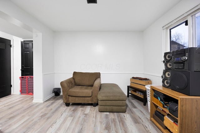 sitting room with light hardwood / wood-style floors