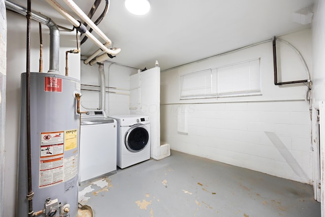 washroom with gas water heater and independent washer and dryer