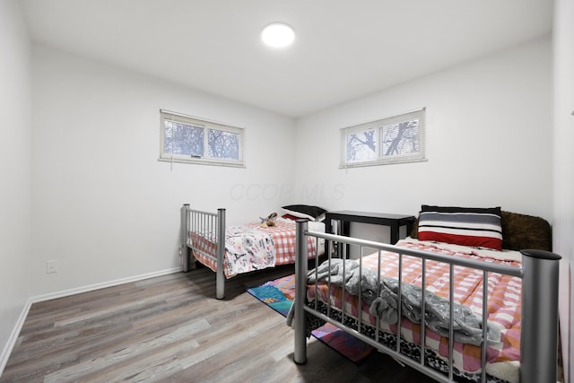 bedroom with hardwood / wood-style floors