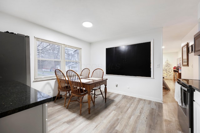 dining area with light hardwood / wood-style floors