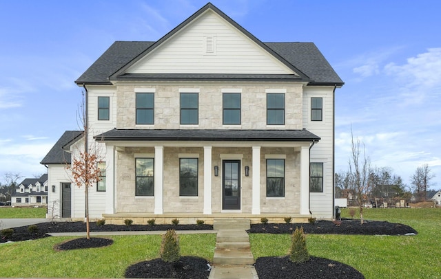 view of front of home with stone siding, a front lawn, and a porch