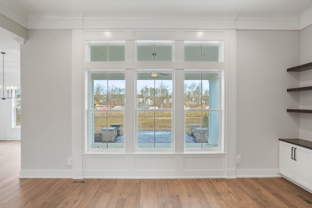 doorway to outside featuring light wood-style floors and plenty of natural light