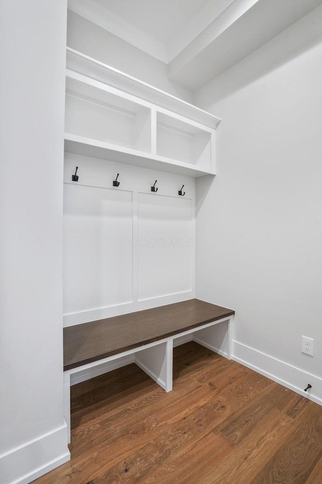 mudroom featuring wood finished floors and baseboards