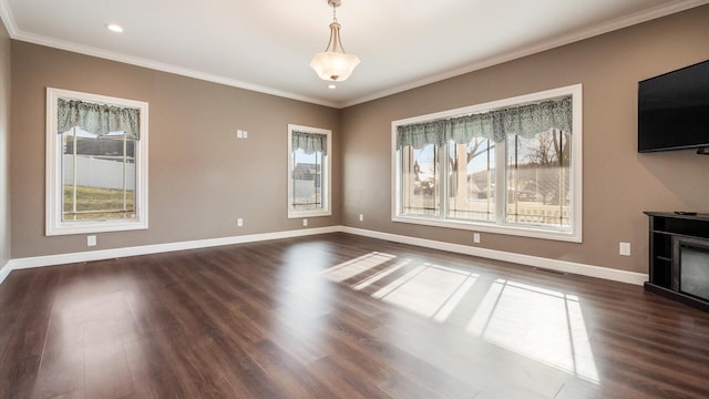 unfurnished living room with dark hardwood / wood-style floors and ornamental molding