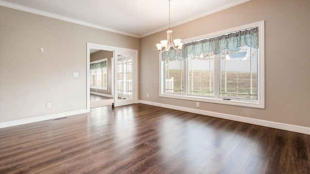 unfurnished dining area with dark hardwood / wood-style flooring, crown molding, and a chandelier