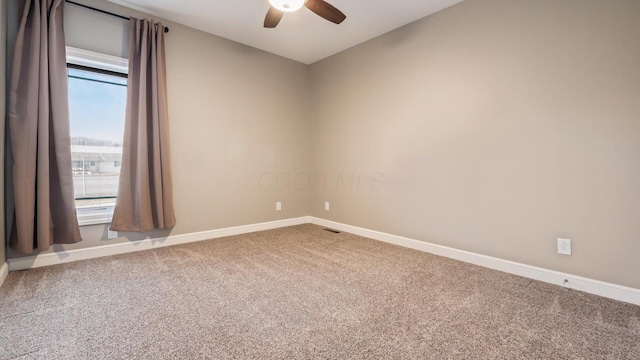 carpeted empty room with ceiling fan