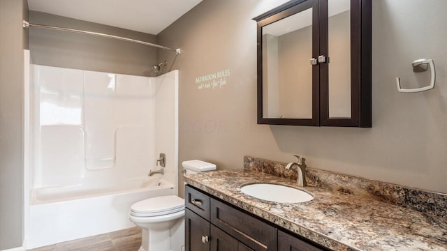 full bathroom with vanity, toilet, and bathtub / shower combination