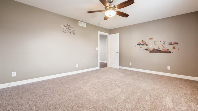 empty room featuring ceiling fan and carpet floors