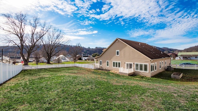 view of home's exterior featuring a yard and central air condition unit