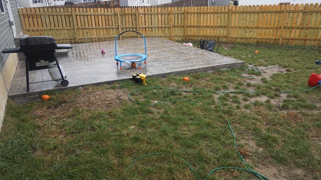 view of yard featuring a patio and fence