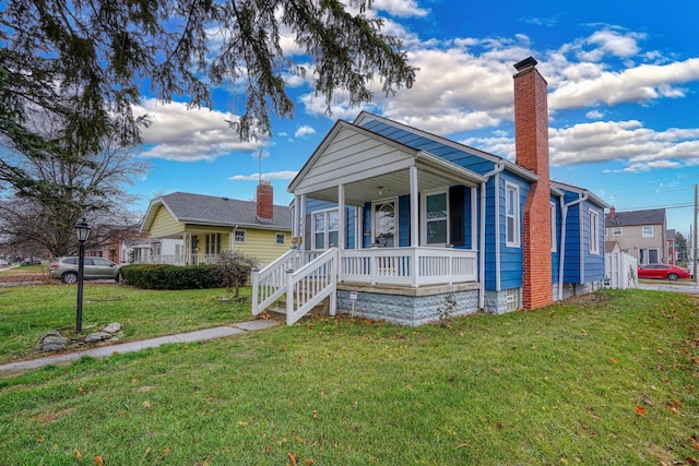 bungalow-style house with a porch and a front lawn