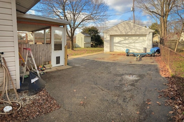 view of yard featuring an outbuilding and a garage