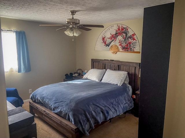 bedroom with carpet flooring, ceiling fan, and a textured ceiling