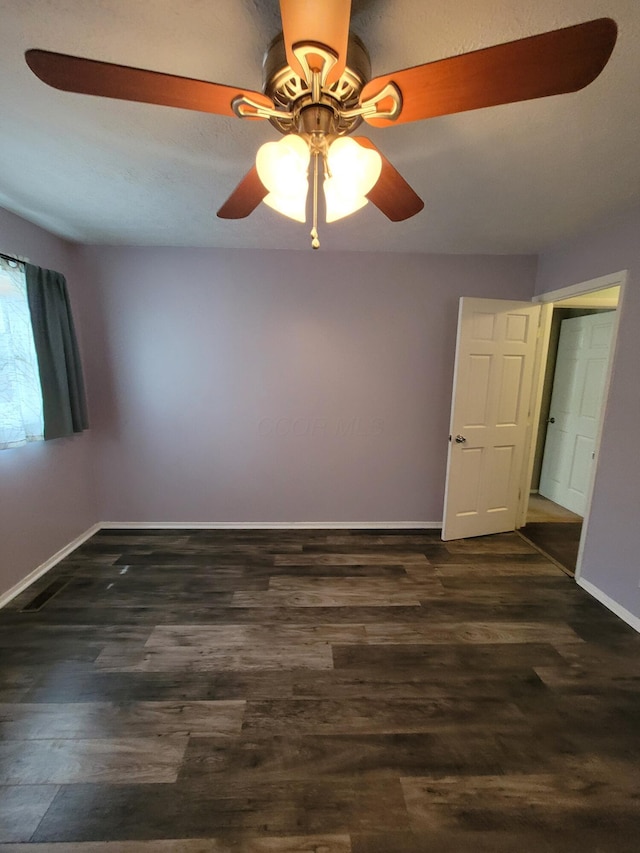 7358 Roshon Ave, Reynoldsburg, OH 43068 - unfurnished room featuring ceiling fan, baseboards, and dark wood-style flooring