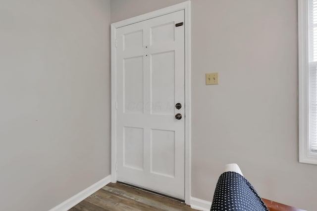 doorway to outside with wood-type flooring