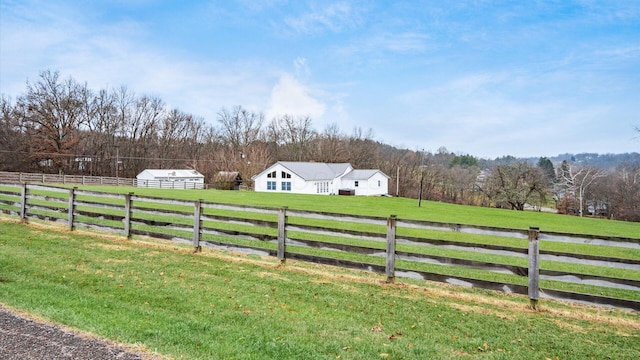 view of yard with a rural view