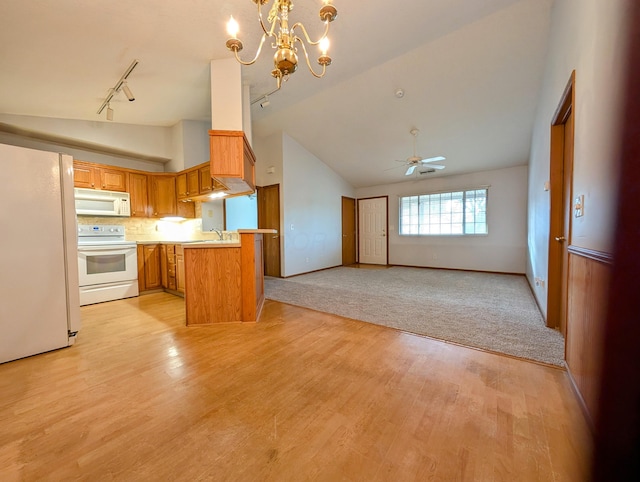 388 Virginia Ct, Pataskala, OH 43062 - kitchen with white appliances, track lighting, light countertops, light wood finished floors, and open floor plan