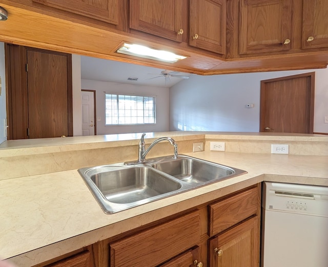 kitchen featuring kitchen peninsula, white dishwasher, ceiling fan, and sink